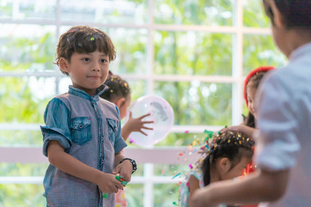 Kids are playing and throwing paper in kid party