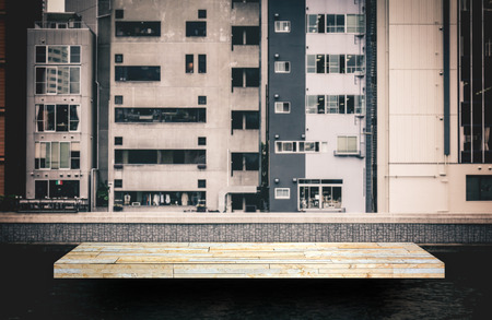 cream stone rock shelf counter with building backgroundの写真素材