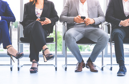 Feets of Business people sitting in chairs, no faceの写真素材