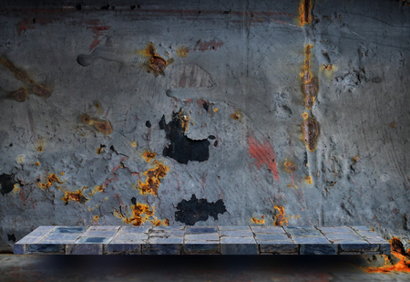 Empty stone shelf on rustic metal wall for product displayの写真素材