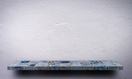 Gray stone rock counter display on white wallの写真素材
