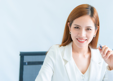 Confidence Asian Business woman in white portrait business officeの写真素材