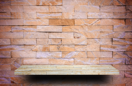 Cream Rock counter shelf on orange black rock backgroundの写真素材