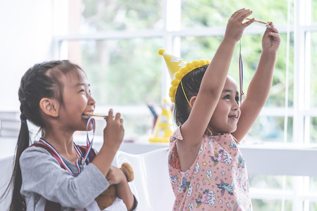 Little girl is bitting gold medal for student awardの写真素材