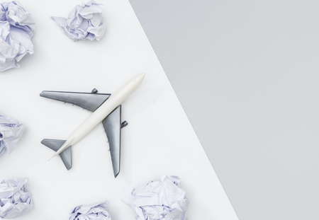 Toy plane is traveling the world concept on white and grayの写真素材