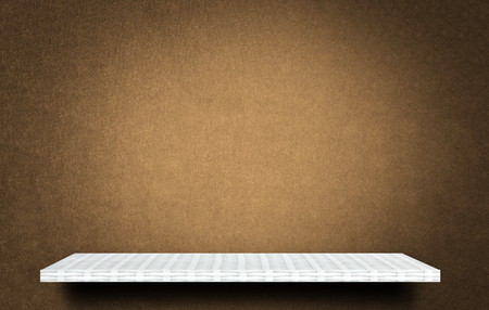 Empty top white shelves brown wall background product displayの写真素材