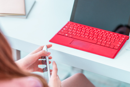 Business woman using laptop in business officeの写真素材