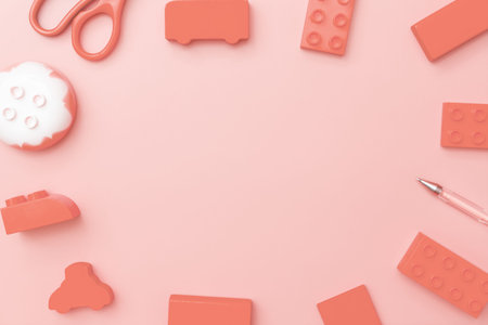 Kids toys frame on red background with toys flat lay top view with empty center