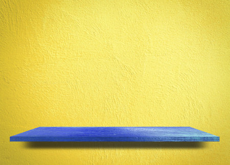 Blue wooden on yellow background product display shelf table top copy space backgroundの写真素材