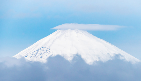 Close up top view of Fuji mountain with snow cover with couldの写真素材