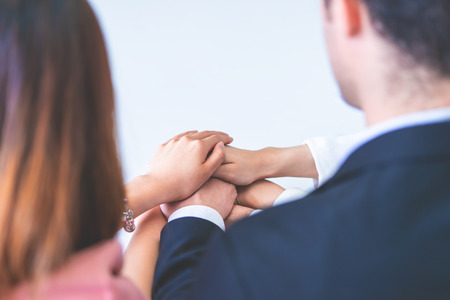 Office people putting hand together for business team success conceptの写真素材