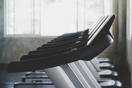 Empty Treadmill line up in Gym fitness training roomの写真素材