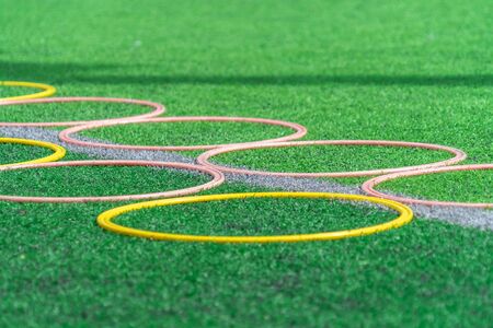 Soccer sport training equipments on green outdoor soccer training fieldの写真素材