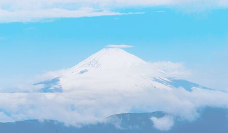 Close up top view of Fuji mountain with snow cover with couldの写真素材