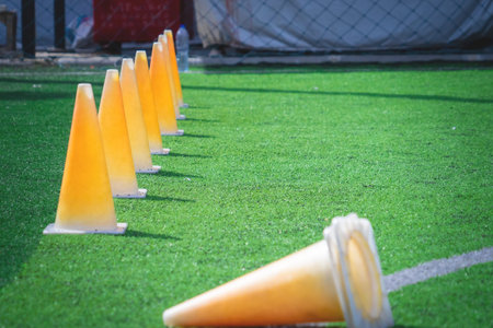 Soccer sport training equipments on green outdoor soccer training field