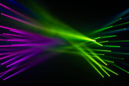 Spotlight Disco and stage light beam in green and purple for abstract backdrop and background blur line party and clubbing conceptの写真素材