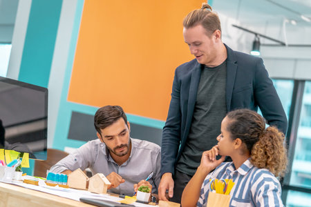 Three Team of young Architect creative Designer is brainstorming in office for Diverse modern...