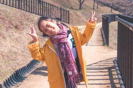 Tourist Family is walking up to the Chureito Pagoda shrine to view the Fuji Mountain