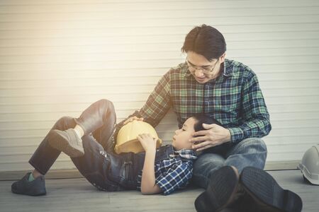 Builder Father is talking to his son for future career and teaching profession skill for his son, For Family future education concept.の写真素材