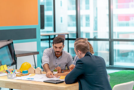 Team of young Real Estate Contractor is brainstorming in office