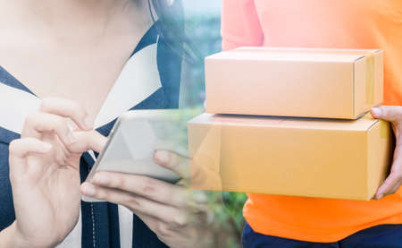 Woman making mobile shopping and fast delivery for E commerce and online shopping concept.の写真素材