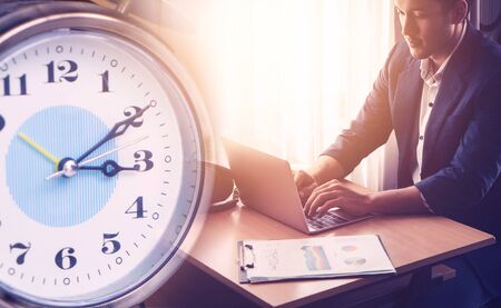 Working over the clock, Office worker at overtime shift, finish work on time. Business deadline conceptの写真素材