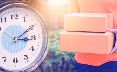 Fast time online shopping delivery with courier carrying box with clock counting deadline.