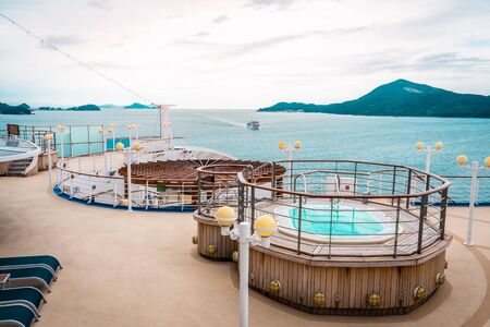 Toba, Japan - 24 Sep 2019 : Back balcony of Diamond princess cruise ship with service Bar and Swimming pool with the view of Toba island in background.のeditorial素材