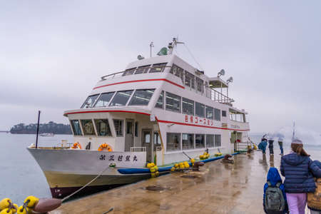 Sendai; Japan - 30 Dec 2019: Tourists are getting on a sightseeing Boat that go around Matsushima Bay.のeditorial素材