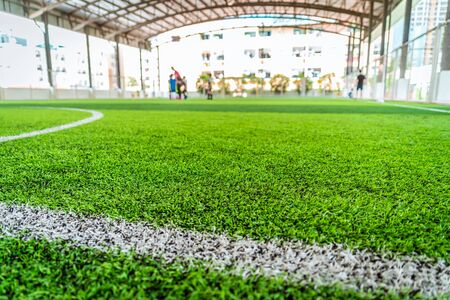 Inddor soccer football field with green artifact grassの写真素材