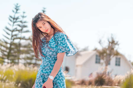 Female tourist is sitting on a Boat on a beach sunset for summer Vacation concept.の写真素材