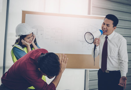 Unhappy Construction team Boss is shouting aggressively to his employer in team meeting.