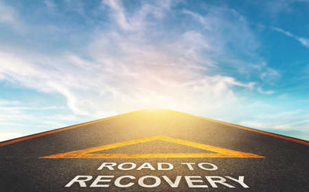 Road to recovery concept for business and health concept with Blue cloud sky background.