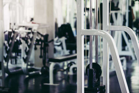 White Weight training Workout equipments with no body for indoor sport fitness room background.の写真素材