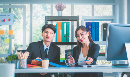 Asian business couple male and female is working together in the office.の写真素材