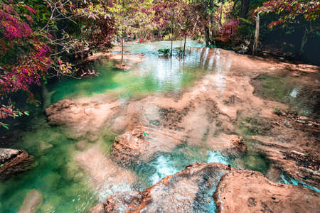 Erawan waterfall in Kanchanaburi with beautiful foliage and rock in rich forest.の写真素材