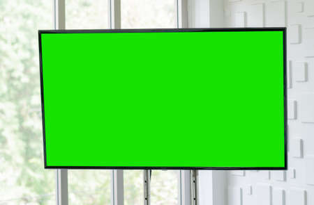 Blank TV screen with green chroma key for display screen mock up and template.の写真素材