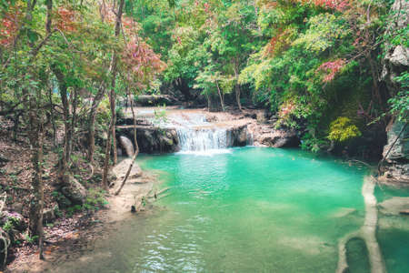 Erawan waterfall in Kanchanaburi with beautiful foliage and rock in rich forest.の写真素材