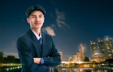 Confidence businessman portrait with Modern night light City Background.の写真素材