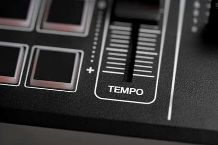 DJ tempo fader on a Digital DJ controller closed up shot.の写真素材