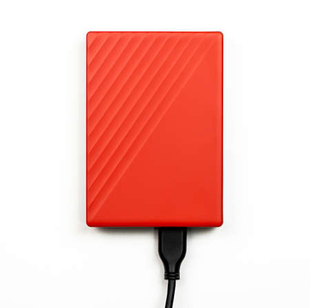 Orange External Hard drive isolated on white. top view.の写真素材