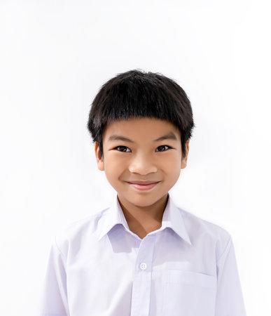 Asian student portrait isolated on white with school uniform smilingの写真素材
