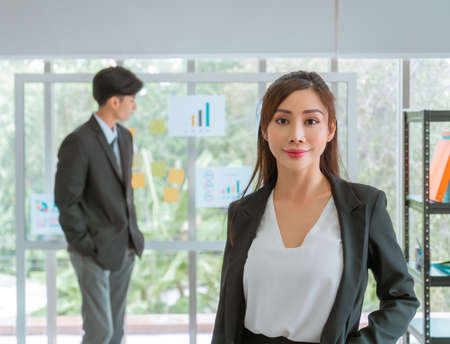 Portrait of an Asian Business woman Standing on the foreground for leading ship and confidence concept.の写真素材