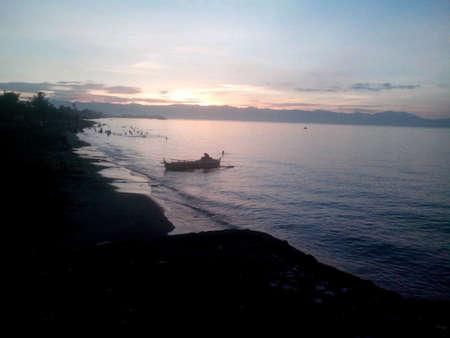 Fishing boat on the shoreの素材