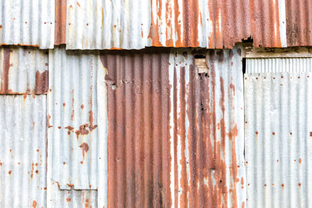 Old Zinc background, Rusted corrugated zinc sheets overlapping to form a fence