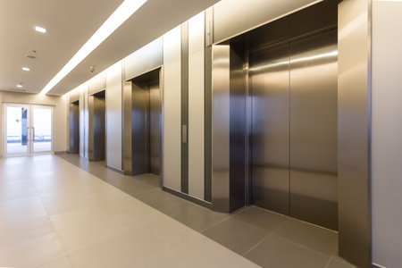 Modern steel elevator cabins in a business lobby or Hotel, Store, interior, office,perspective wide...