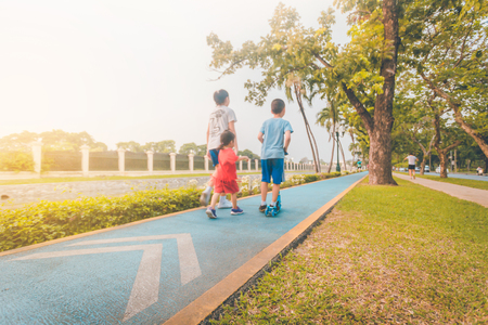 Motion blured, Back view of young sport man runner warm up before running, Background against sunrise morning.の写真素材