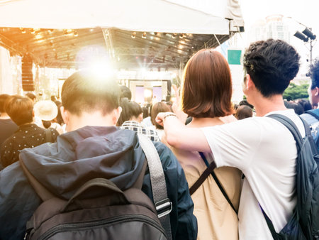 Sad and lonely man standing around concert near happy Young couple