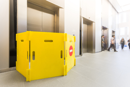 Modern steel elevator repairing  cabins in a business lobby or Hotel, Store, interior, office,perspective wide angle. Three elevators in hotel lobby.の写真素材