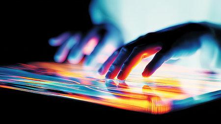 Close-up of human hands touching the screen of a tablet computerの素材
